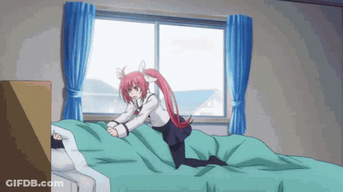 Girl With Long Red Hair Kneeling On Bed GIF