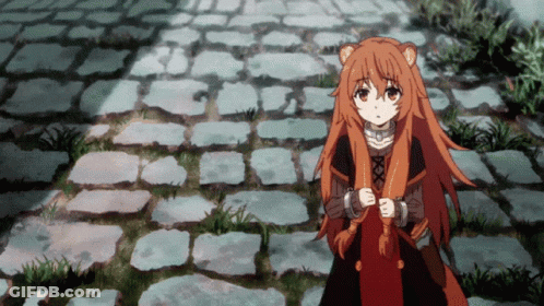 Girl With Long Red Hair On Brick Walkway GIF