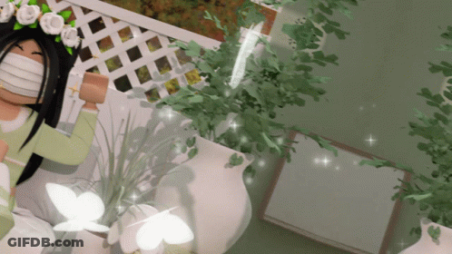 Girl With Mask And Flower Crown Laying In Bed GIF
