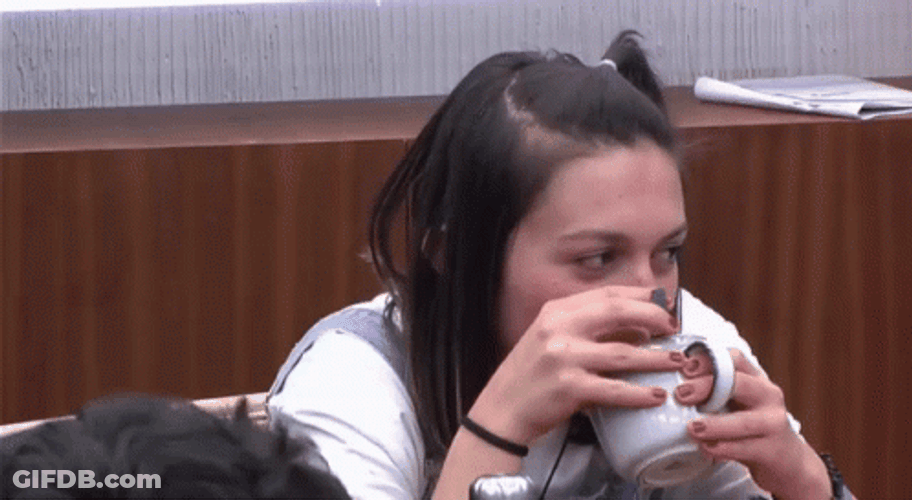 Girl With Obvious Secret Drinking Cup GIF