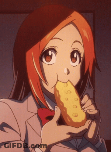 Girl With Orange Hair Eating Yellow Item GIF