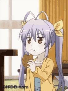 Girl With Pigtails Holding Cookie GIF