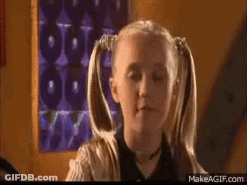 Girl With Pigtails Making Funny Face GIF