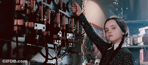 Girl With Pigtails Working On Machine GIF