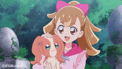 Girl With Pink Bow Holding Dog GIF