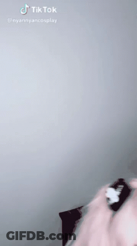 Girl With Pink Hair And Blue Eyes Wearing Cat Ear Cuff GIF