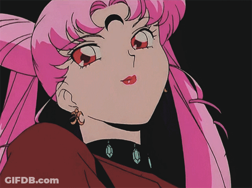 Girl With Pink Hair And Earrings Close Up GIF