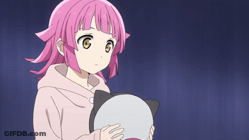 Girl With Pink Hair Holding Cat-Shaped Object GIF