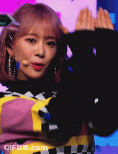 Girl With Pink Hair In Black Sweater GIF
