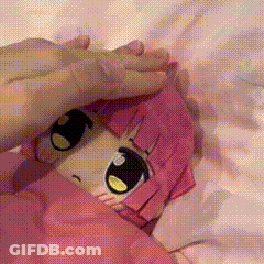 Girl With Pink Hair Lying On Bed GIF