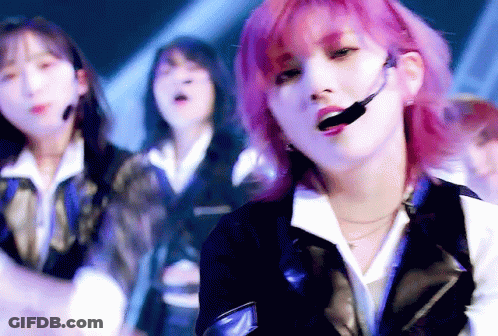 Girl With Pink Hair Singing Into Microphone GIF