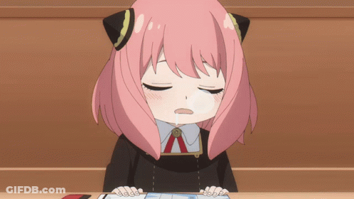 Girl With Pink Hair Sitting At Table GIF