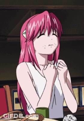 Girl With Pink Hair Sitting With Hands On Chest GIF
