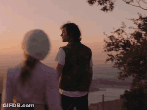 Girl With Pink Hair Standing Next To Another Girl GIF