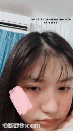 Girl With Pink Sticker On Cheek GIF
