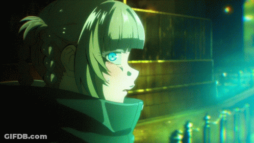 Girl With Ponytail And Blue Eyes In Front Of Building GIF