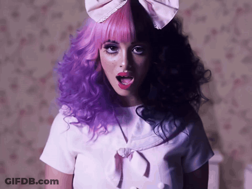 Girl With Purple And Black Hair And Bow GIF