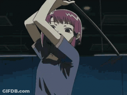 Girl With Purple Hair In Blue Shirt In Dark Room GIF