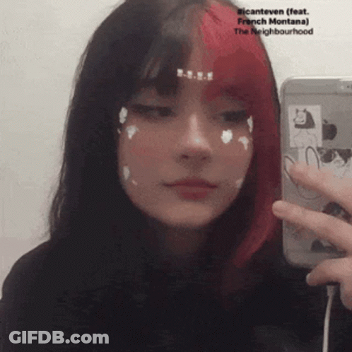 Girl With Red And Black Hair Taking Selfie In Mirror GIF