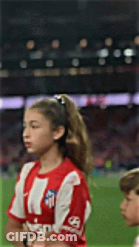 Girl With Red-And-White Striped Shirt Eyes Closed Soccer Field GIF