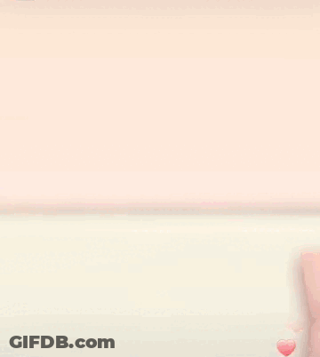 Girl With Red Bow Holding Stuffed Animal GIF