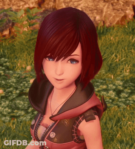 Girl With Red Hair And Blue Eyes Standing In Grass GIF