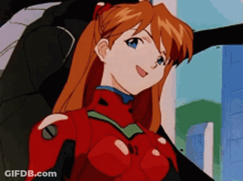 Girl With Red Hair And Blue Eyes Wearing Red And Black Suit GIF