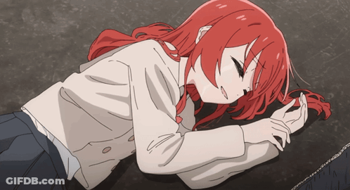 Girl With Red Hair Laying On Ground Eyes Closed GIF