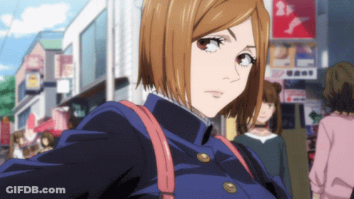 Girl With Short Brown Hair Walking Past Sign Saying A GIF