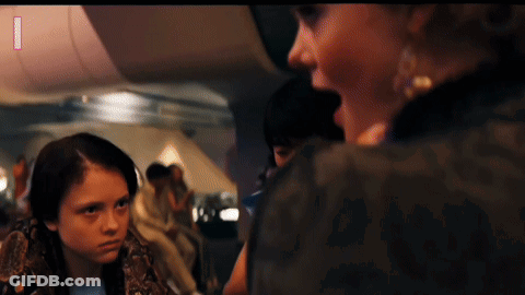 Girl With Snake Around Neck Looking At Woman GIF