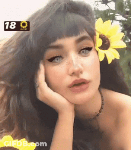 Girl With Sunflower In Hair And Number 18 GIF