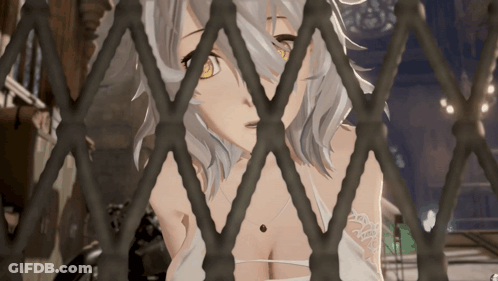 Girl With Tattoo Behind Metal Fence GIF