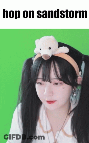 Girl With Teddy Bear Headband Saying Hop On Sandstorm GIF