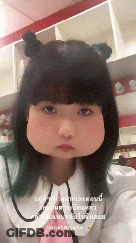Girl With Two Buns Making Funny Face GIF