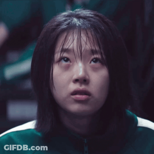 Girl With Wet Hair And Green Jacket Looking Up GIF