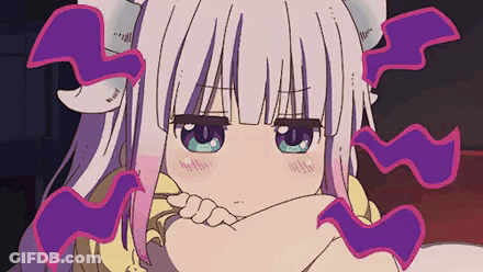 Girl With White Hair And Purple Horns Sitting With Hands On Chin GIF