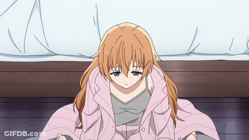 Girl Wrapped In Pink Blanket Sitting On Floor GIF