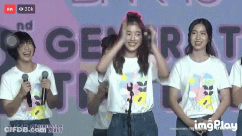 Girls At Microphones With Generation Sign GIF