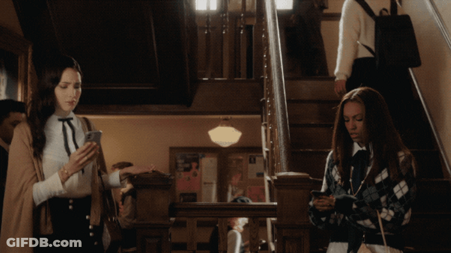Girls Cross Paths While Composing Text Message GIF