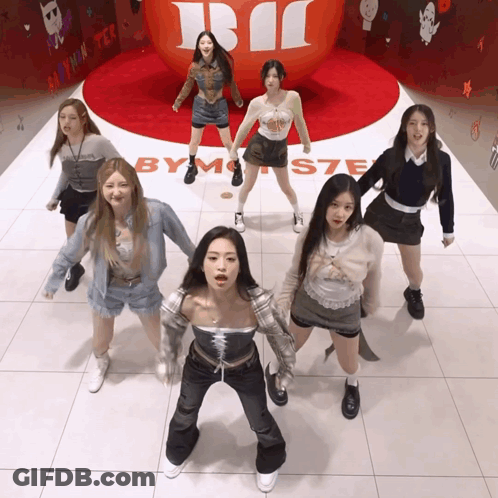 Girls Dancing In Front Of By Monster Sign GIF