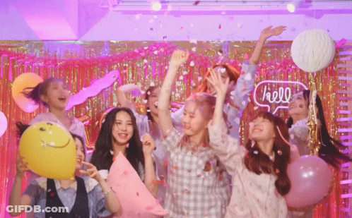 Girls Dancing With Balloons And Confetti Under Neon Hello Sign GIF