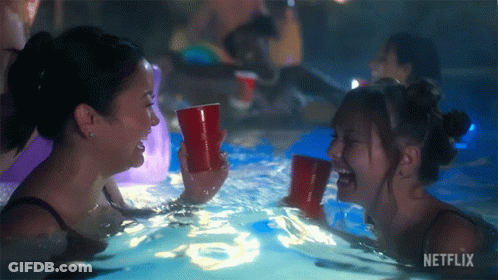 Girls Laughing In Pool With Netflix Logo GIF