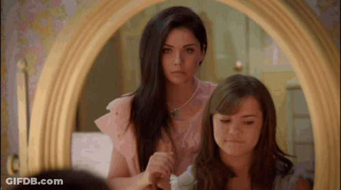 Girls Looking In Mirror And Brushing Hair GIF