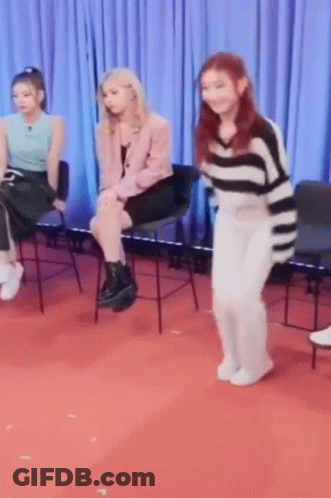 Girls Sitting In Chairs On Red Carpet GIF