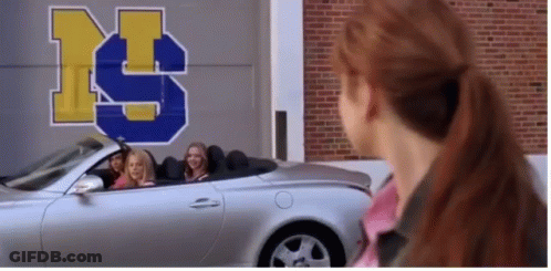Girls Sitting In Silver Convertible Car In Front Of Building With Letter S GIF