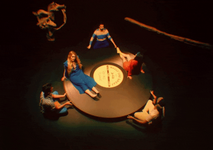Girls Sitting On Spinning Vinyl Records GIF