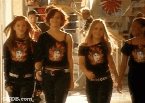 Girls Walking Down Hallway In Black Shirts GIF