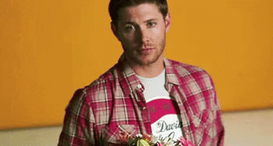 Giving Flowers Serious Man GIF