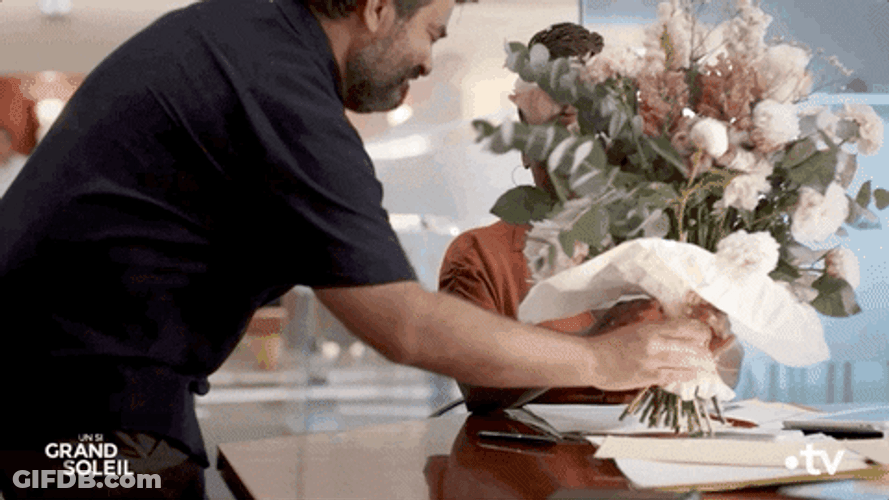 Giving Flowers To A Workmate GIF