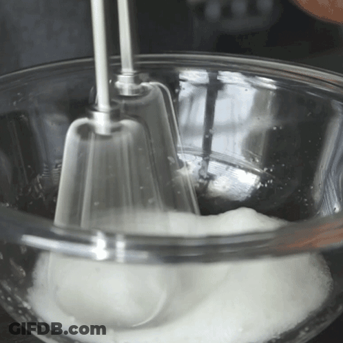Glass Bowl Of Whipped Cream With Mixer GIF